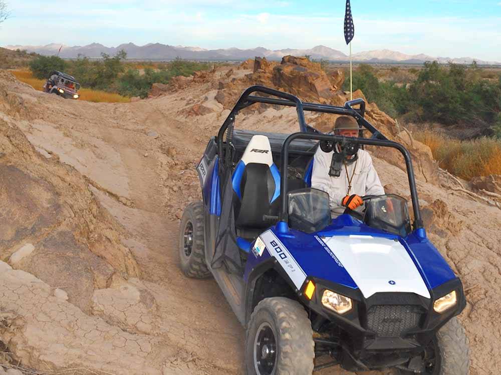 An ATV driving in the desert at SONORAN DESERT RV PARK