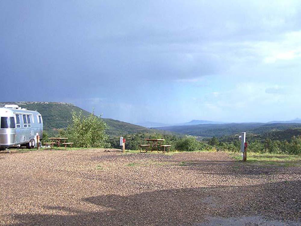 Gravel sites with picnic tables at RATON PASS CAMP & CAFE