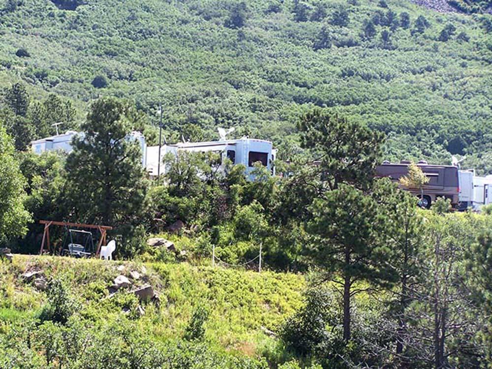 RVs amongst trees at RATON PASS CAMP & CAFE