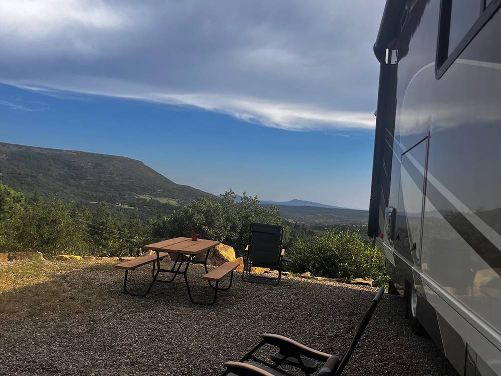 Picnic table and chairs outside an RV