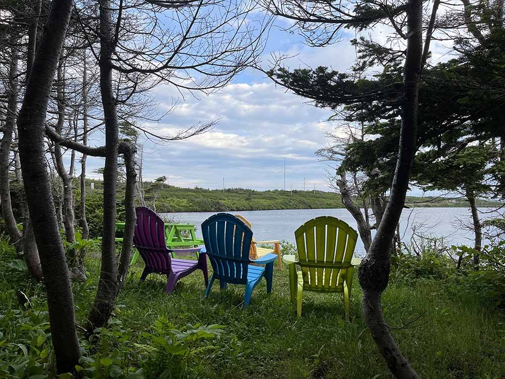 Colorful chairs overlooking the water at VIKING RV PARK