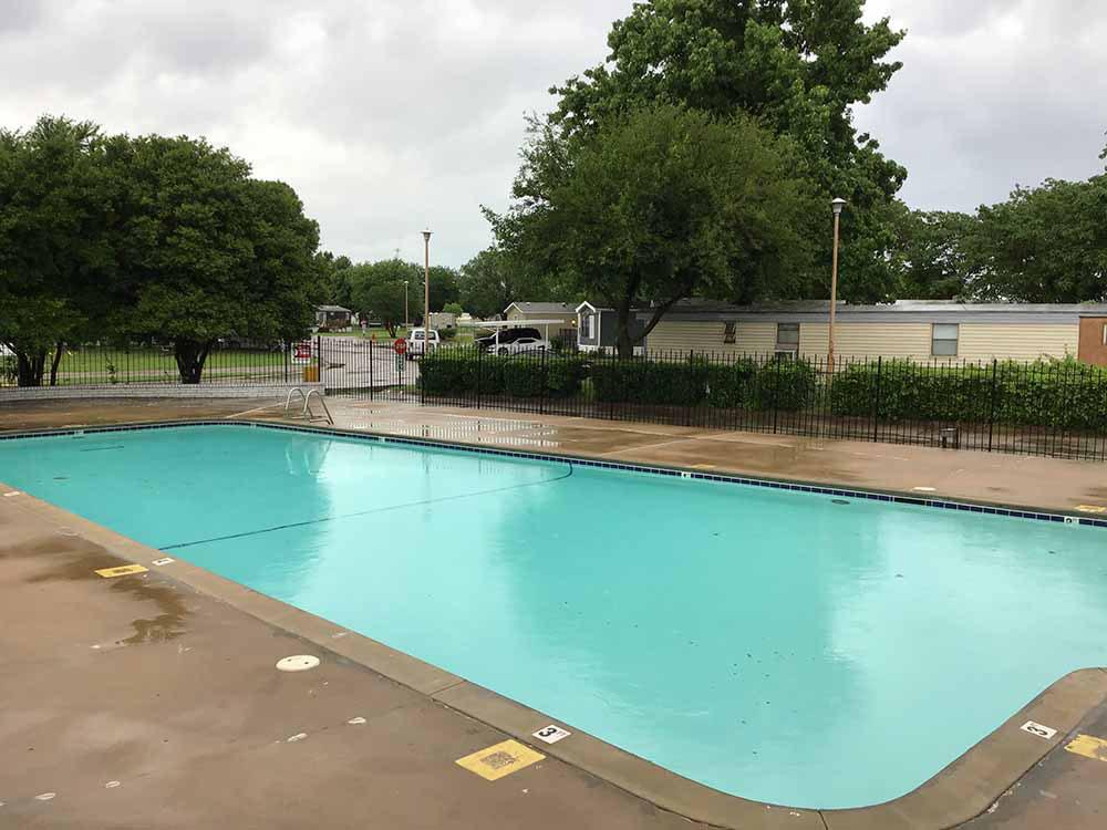 The fenced in swimming pool at CHERRY HILL MH & RV COMMUNITY