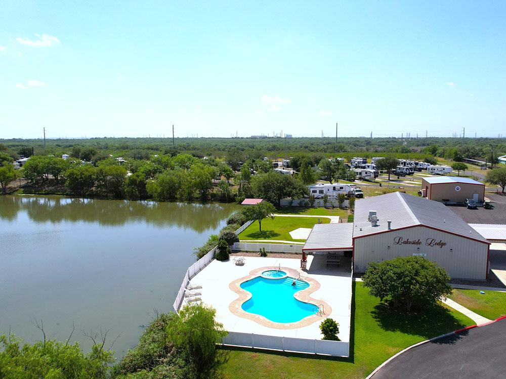 Aerial view of pool and pond at BRAUNIG LAKE RV RESORT