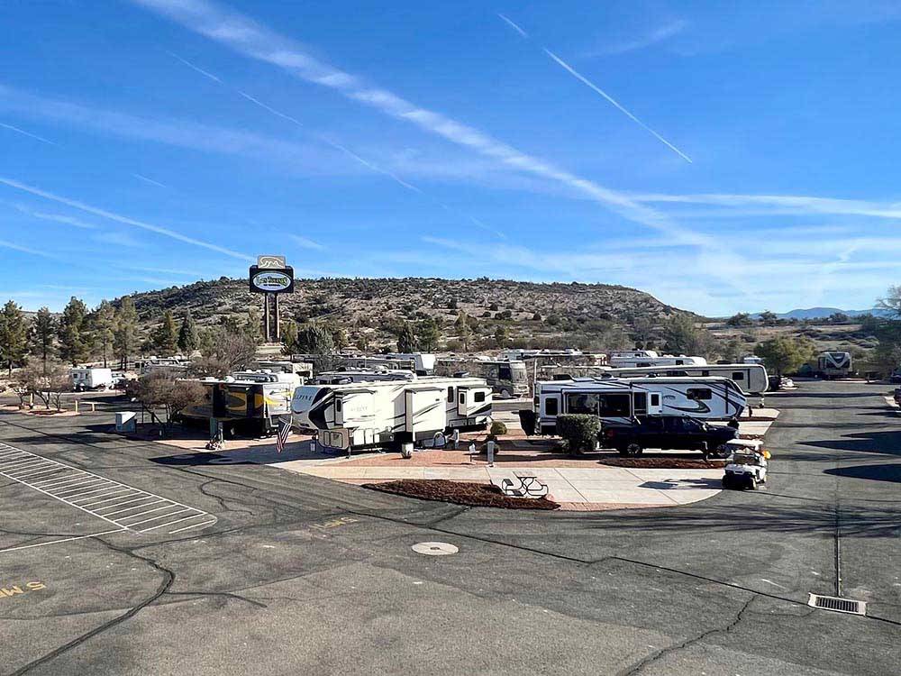 A view of trailers in paved sites at DISTANT DRUMS RV RESORT