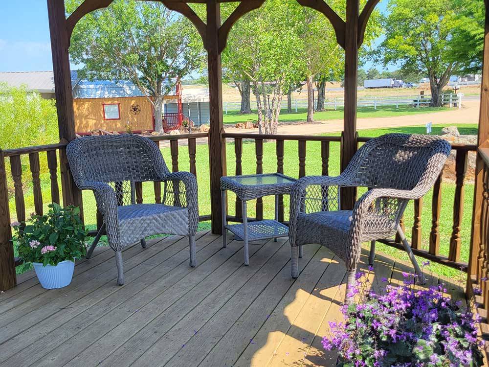 Chairs and table under a gazebo at CANTON I-20 RV PARK
