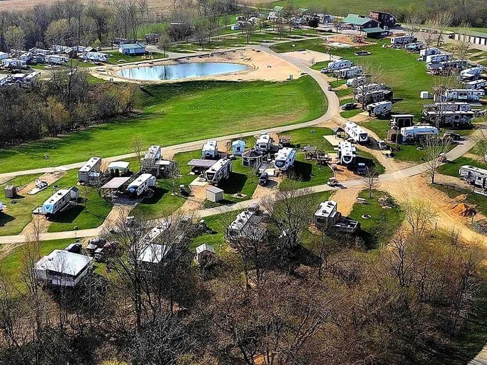 Aerial view of RVs parked in gravel sites at WHITETAIL BLUFF CAMP & RESORT