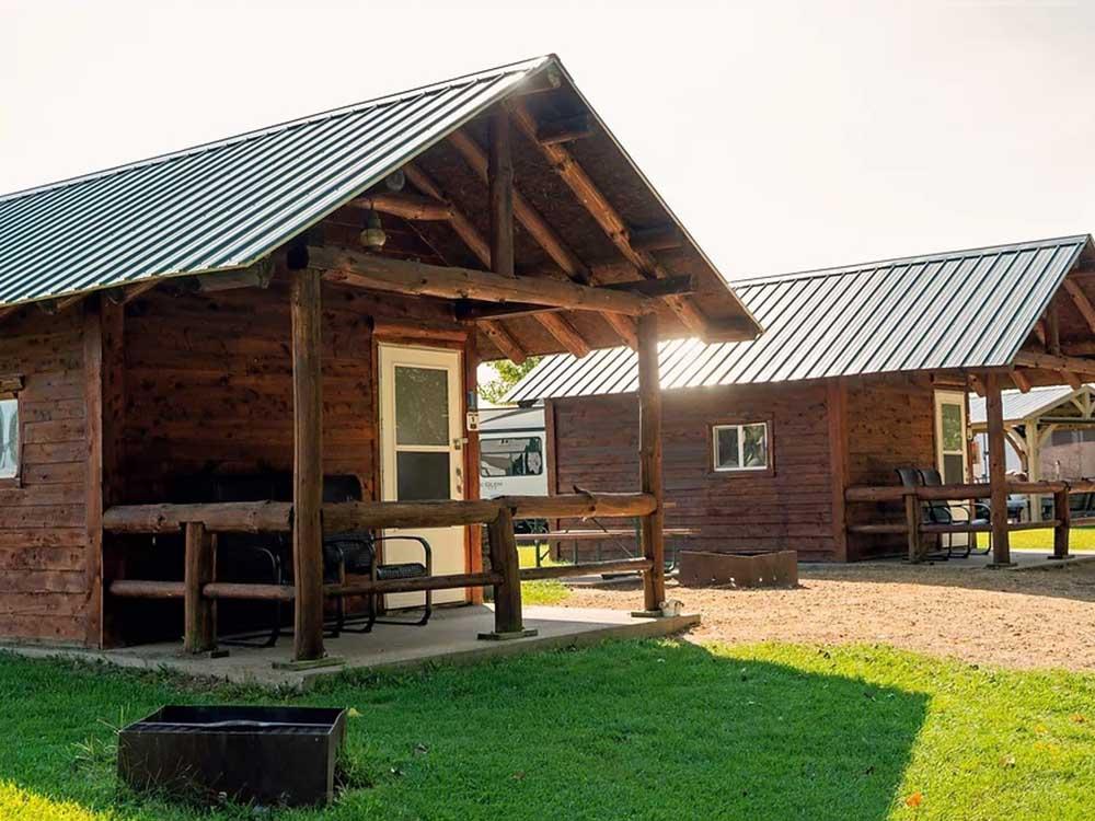 Two cabin rentals with fire pits at WHITETAIL BLUFF CAMP & RESORT