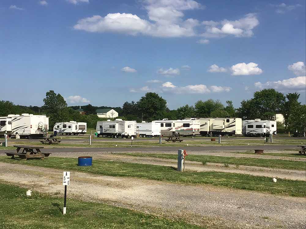A row of gravel pull thru RV sites at CAPE CAMPING & RV PARK
