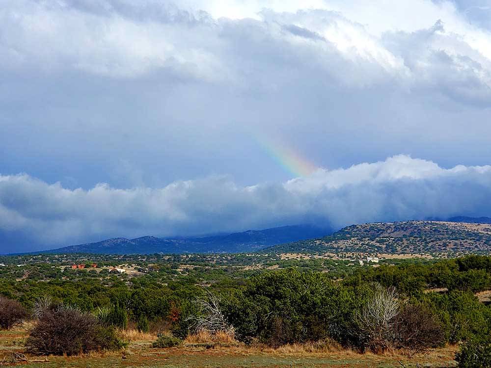 A view of the valley with a rainbow at LA VISTA RV PARK