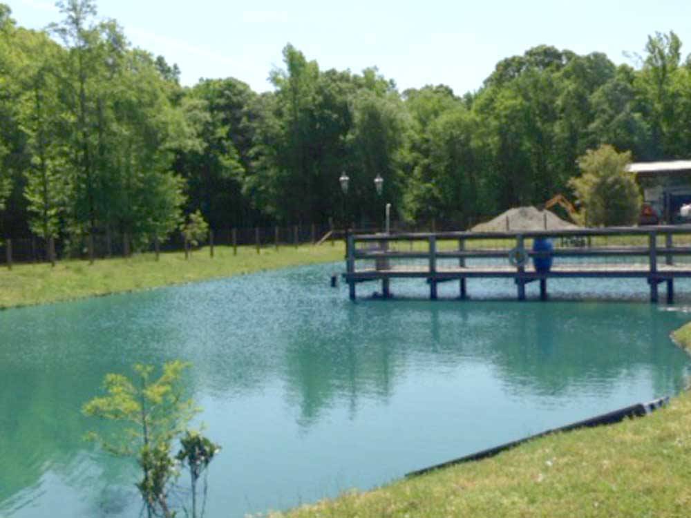 A fishing pier on the water at Jolly Acres RV Park & Storage