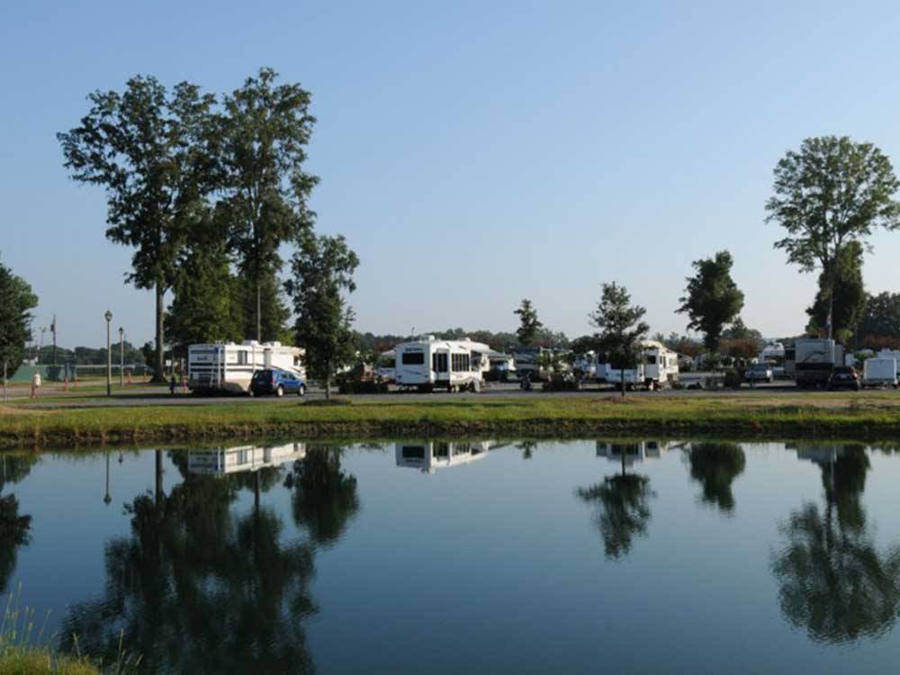 An aerial view of the campsites and lake at CAPITAL CITY RV PARK