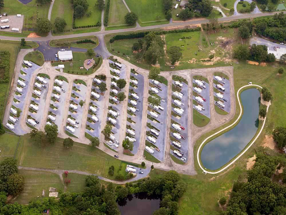 An aerial view of the campsites and lake at CAPITAL CITY RV PARK