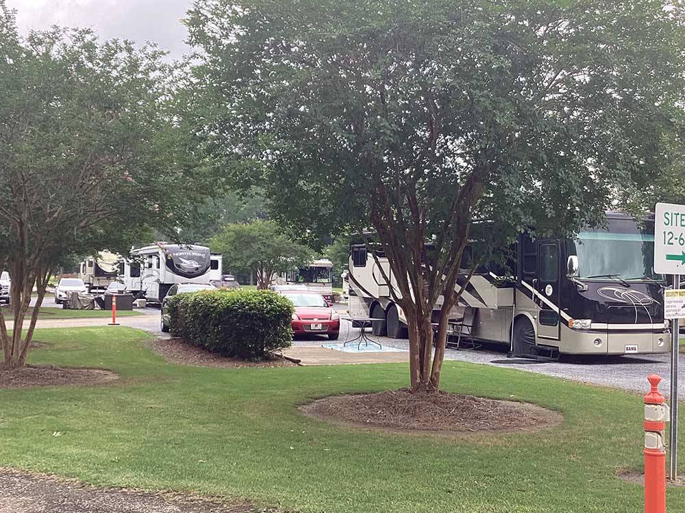 A motorhome in a paved RV site at CAPITAL CITY RV PARK