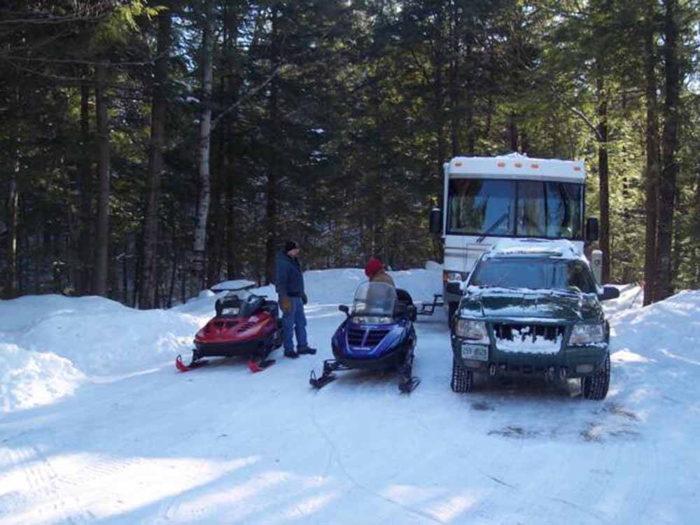 A pair of snowmobiles at MEREDITH WOODS 4 SEASON CAMPING AREA