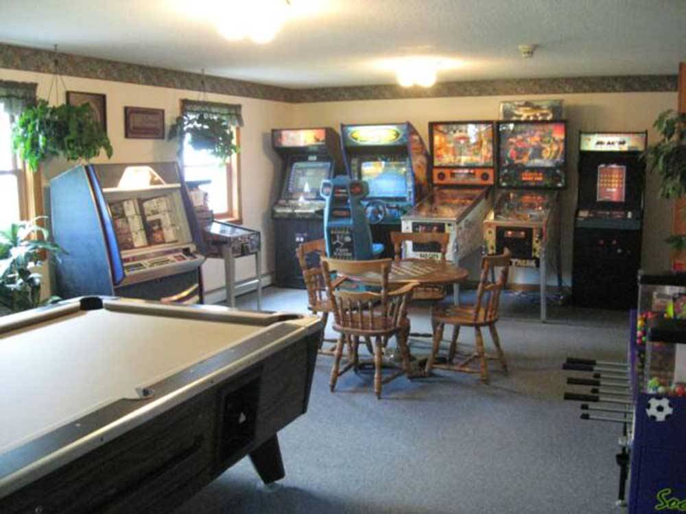 Lounge with pool table and classic arcade games at MEREDITH WOODS 4 SEASON CAMPING AREA