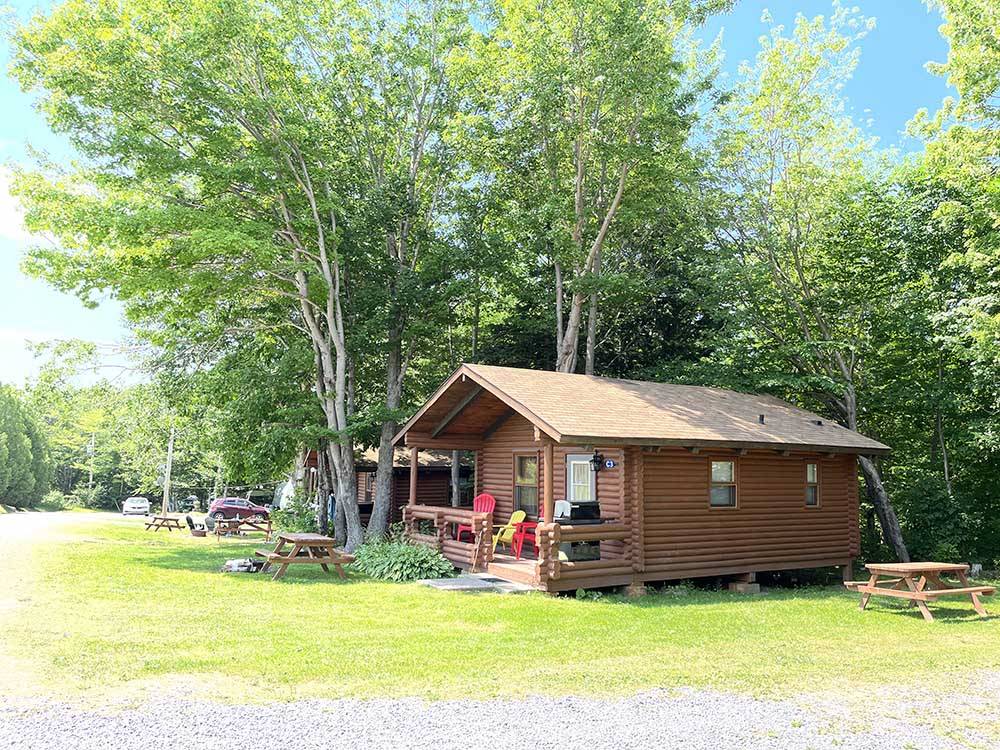 A row of rental cabins at ADVENTURES EAST CAMPGROUND & COTTAGES