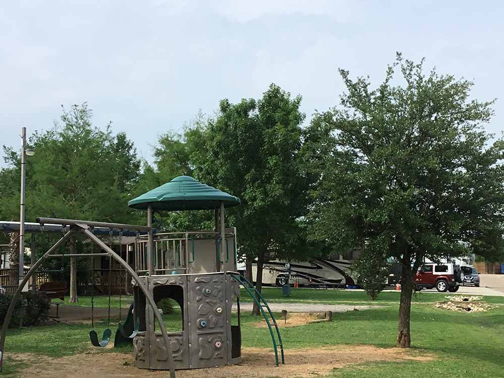 Play structure with swingset at TEXAN RV RANCH