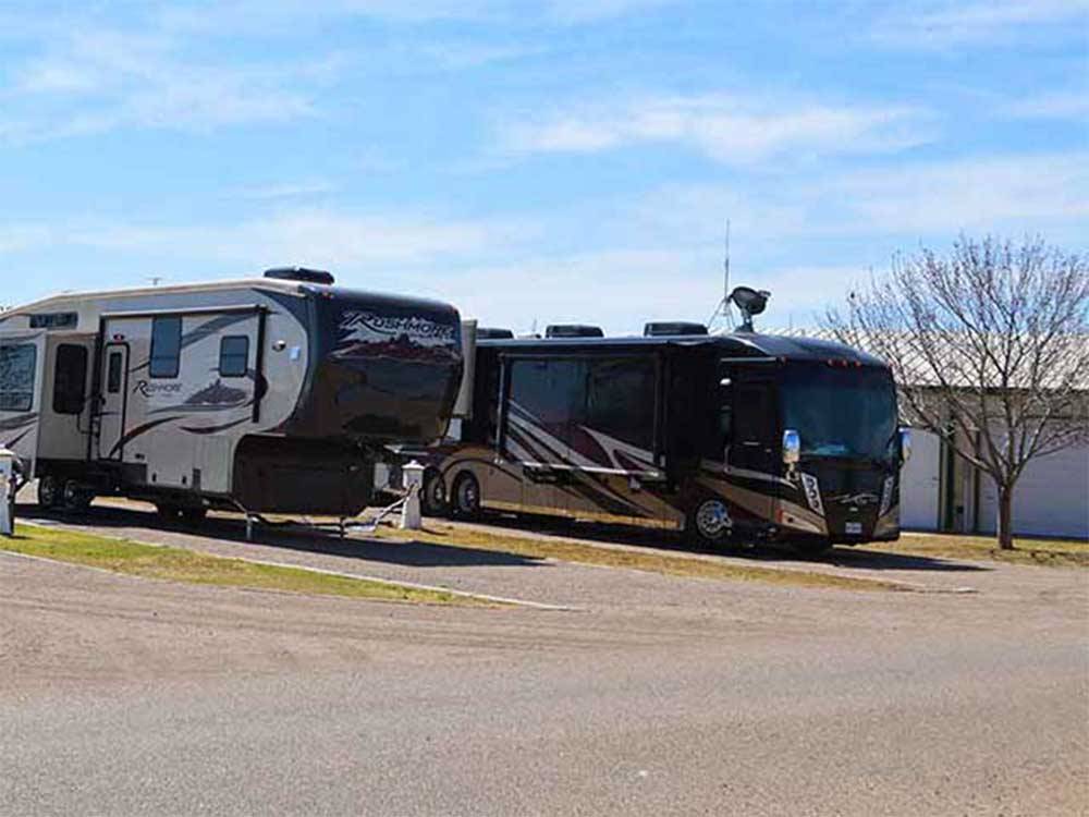 A row of paved RV sites at MESA VERDE RV PARK