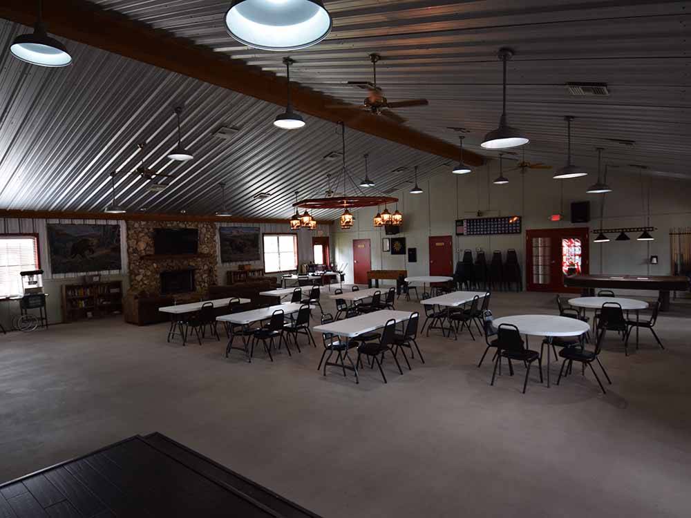 A large recreation hall with seating at WILD FRONTIER RV RESORT
