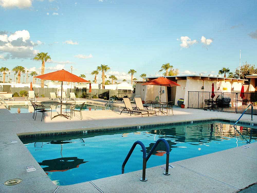 Swimming pool with outdoor seating at ENCORE MESA VERDE