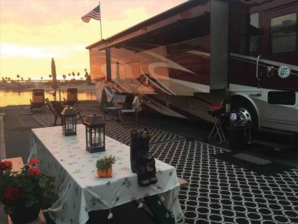 A motorhome on the water at sunset at MISSION BAY RV RESORT