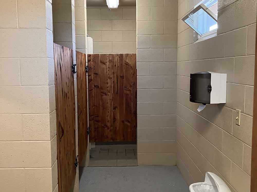 The bathroom stalls with a window at FISHBERRY CAMPGROUND