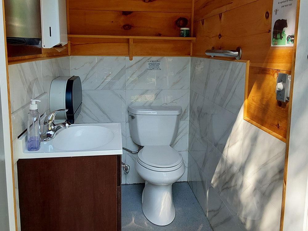 Bathroom with marble and wood interior at CAMP AT NEWFOUND LAKE