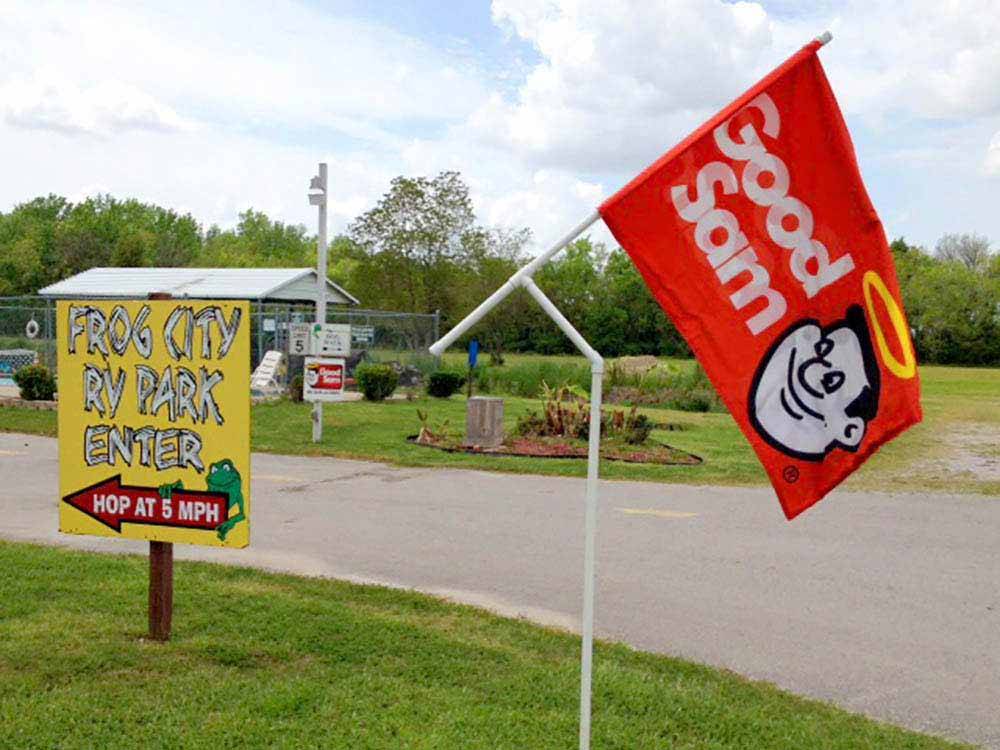 The front entrance sign with a Good Sam flag at FROG CITY RV PARK