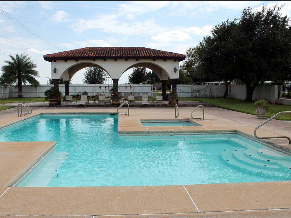 The swimming pool area at LAZY PALMS RANCH RV PARK