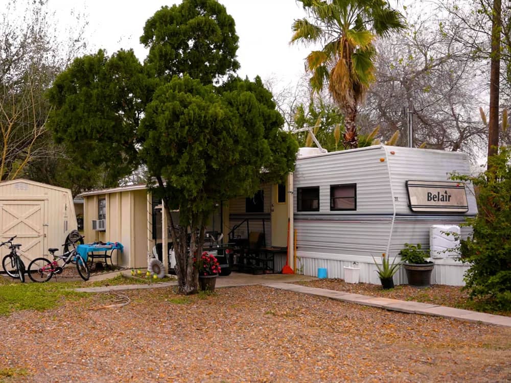 Parked RV lot, vehicles and bikes