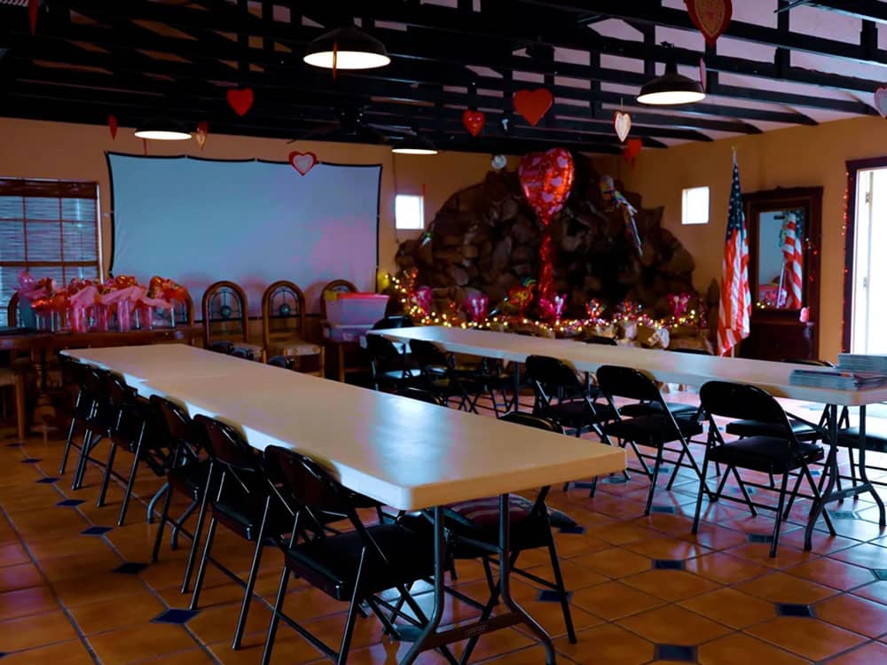 Tables and chairs setup in room