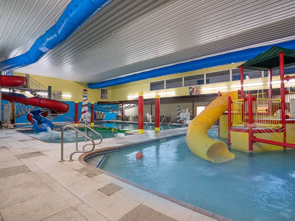 Indoor pools with slides at GOVERNORS' RV PARK CAMPGROUND