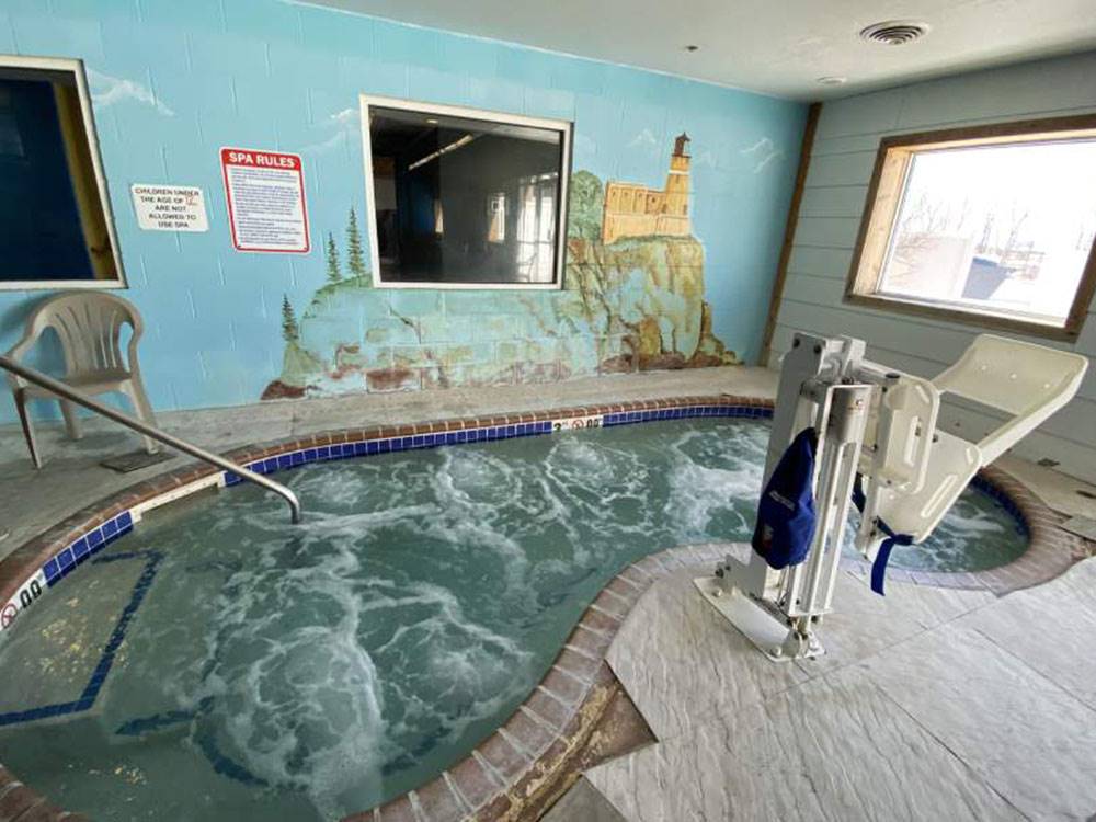 The indoor hot tub with a ADA chair at GOVERNORS' RV PARK CAMPGROUND