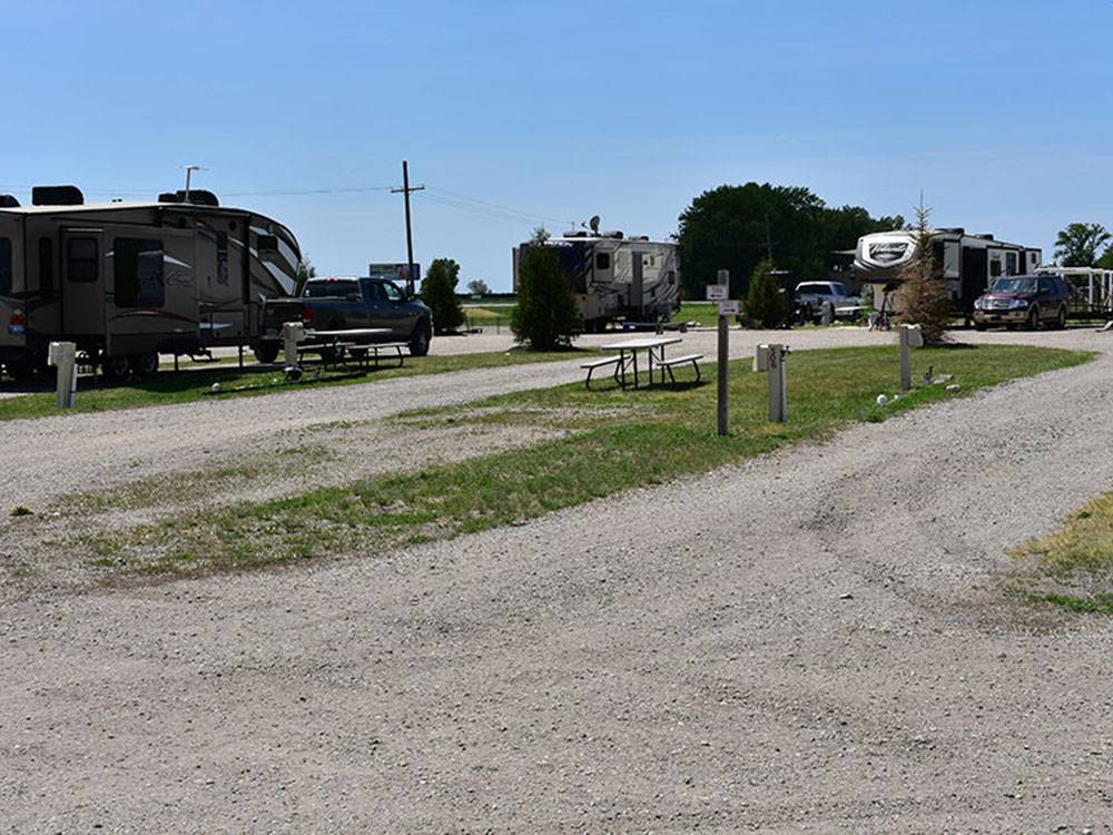 Gravel campsite with picnic table at GOVERNORS' RV PARK CAMPGROUND