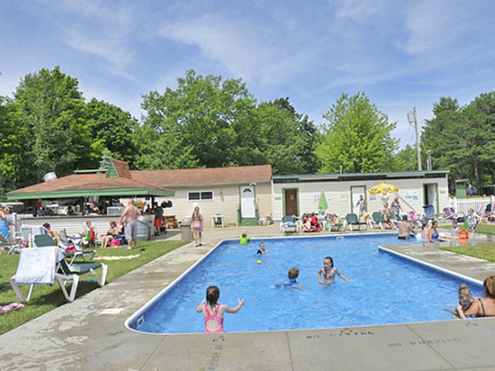 Families playing in the pool at PINEHIRST RV RESORT