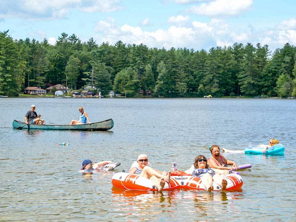 People swimming in the lake at SANDY BEACH CAMPGROUND