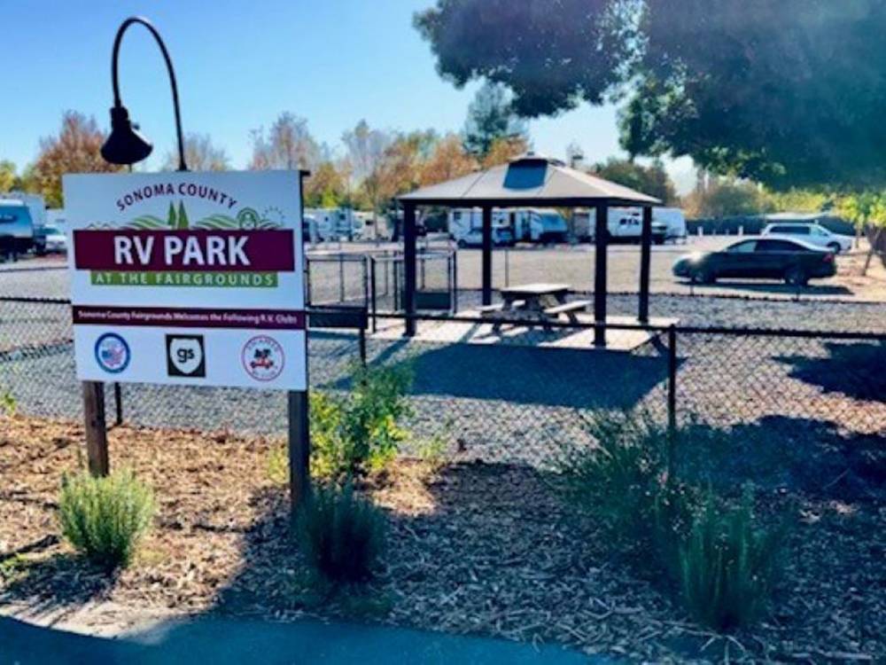 The enclosed dog park with covered seating