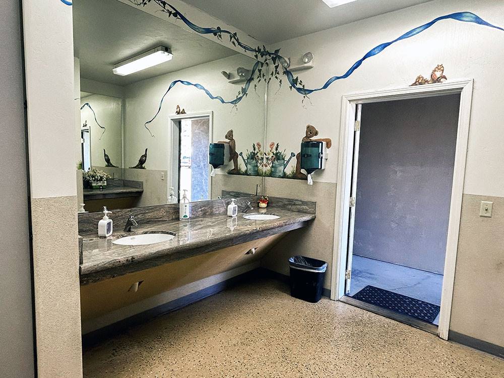 The restroom sinks with large mirror at Klamath Ranch Resort / Blue Heron RV Park