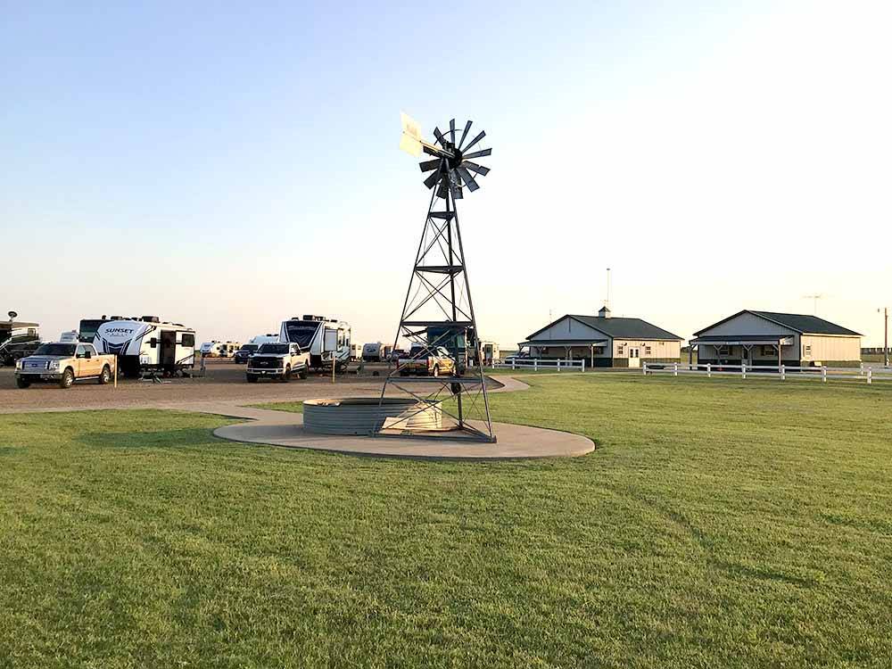 A windmill with RV sites nearby at WESTERN STAR RV RANCH