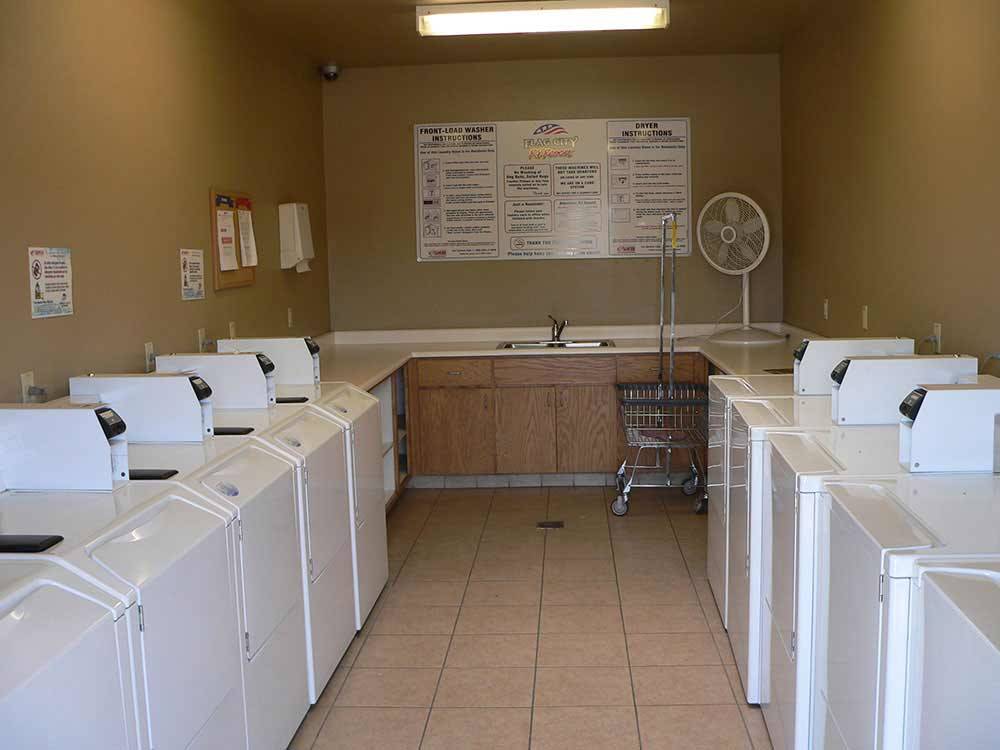 Laundry room with washer and dryers at FLAG CITY RV RESORT