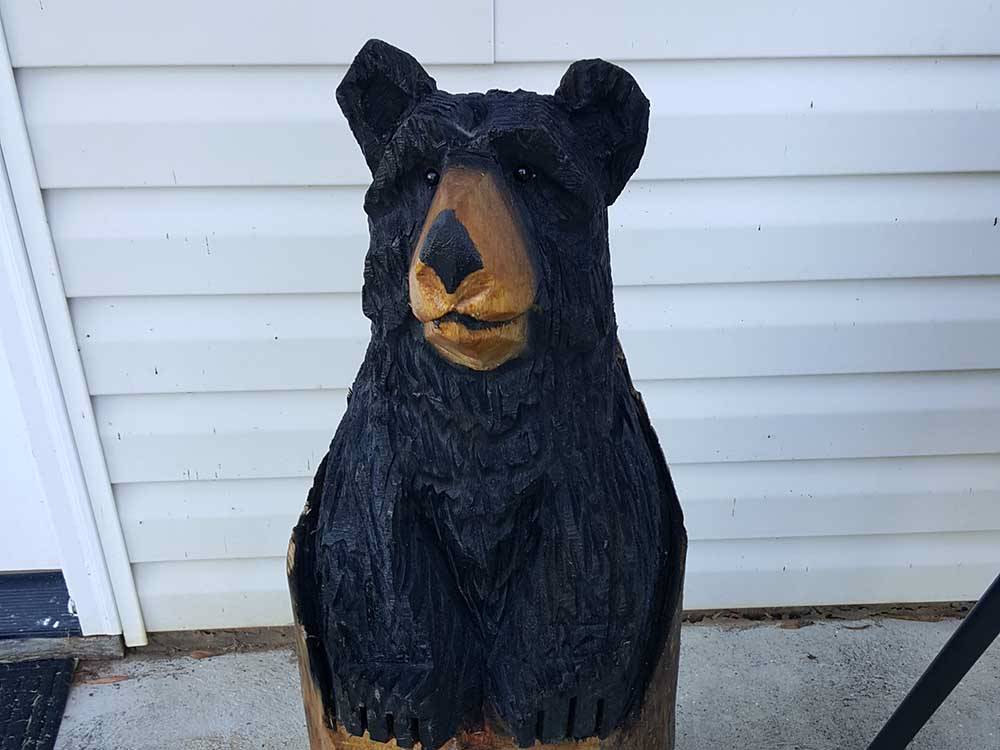 A statue of a black bear at DAN RIVER CAMPGROUND