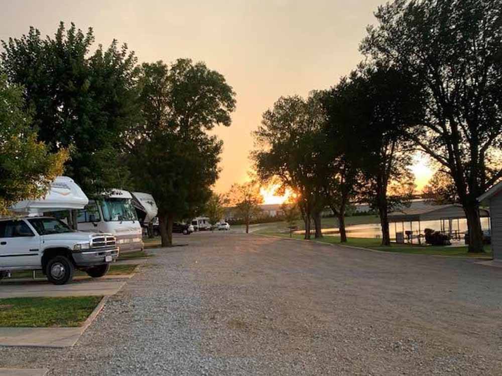 Sun setting at the end of a gravel road at BAILEY'S RV RESORT