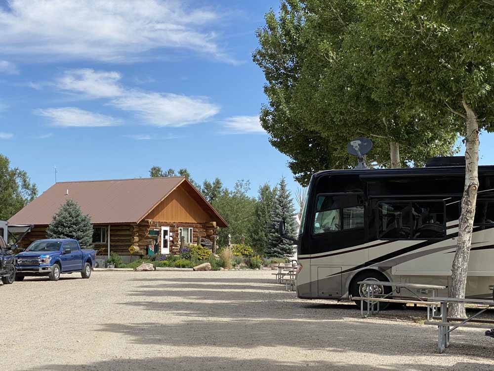 The main building with a motorhome at TWIN PINES RV PARK & CAMPGROUND