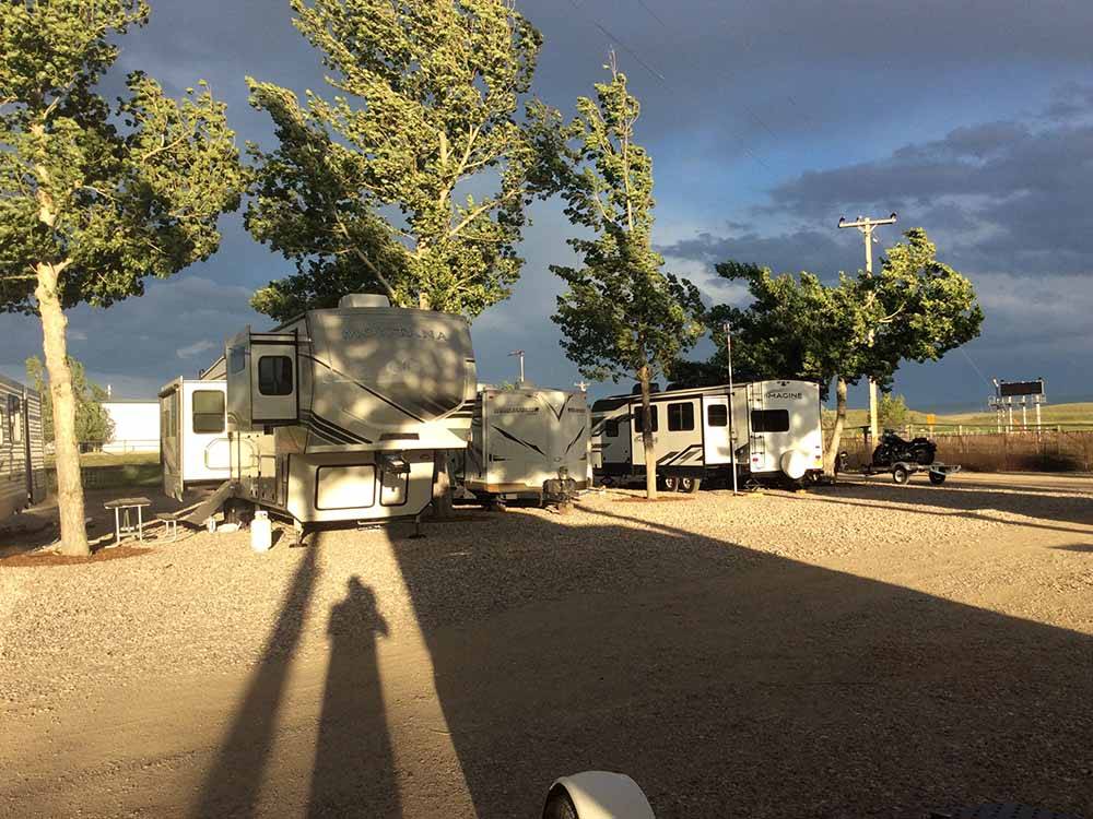 A row of gravel RV sites at TWIN PINES RV PARK & CAMPGROUND