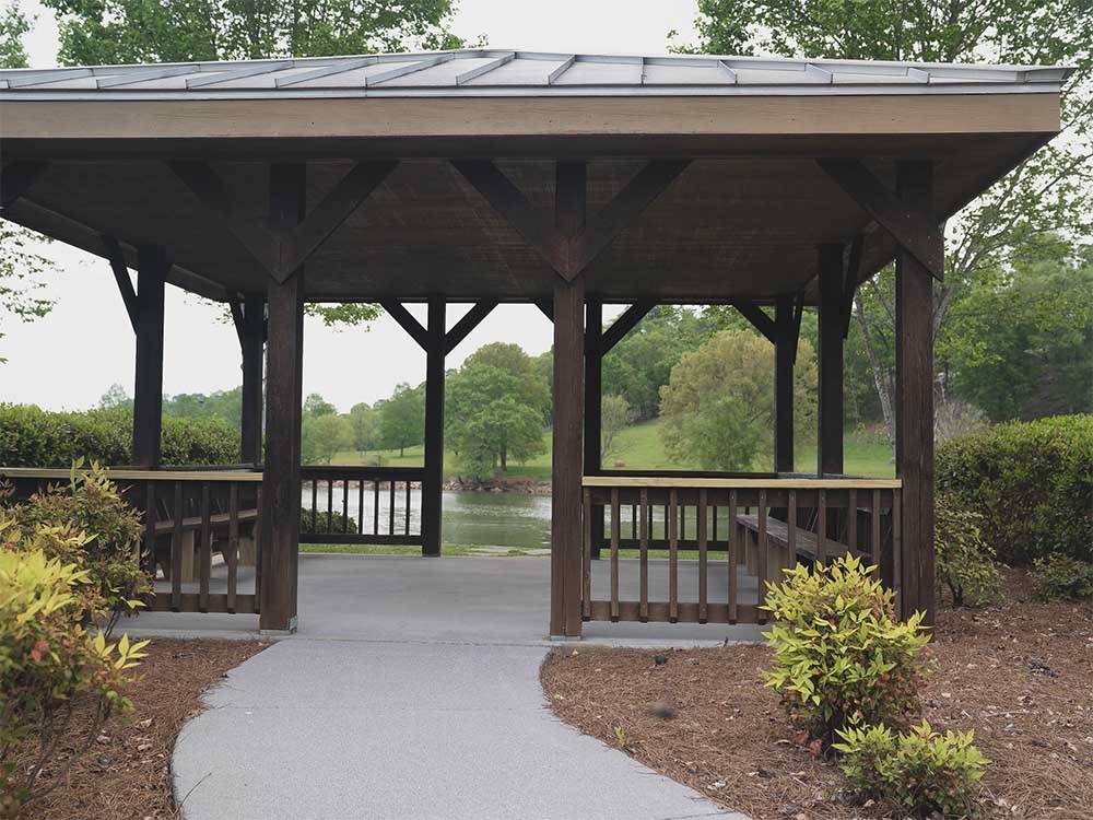 The gazebos next to the river at TWO RIVERS LANDING RV RESORT