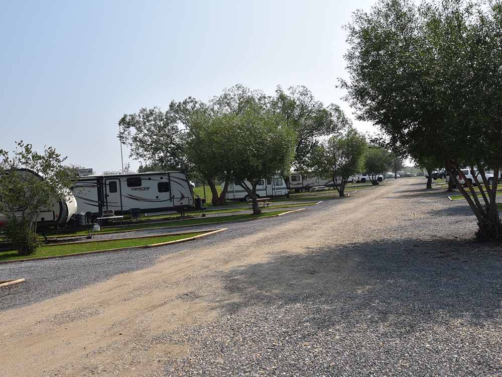 A row of travel trailers parked in sites at HERITAGE LAKE CAMPGROUND