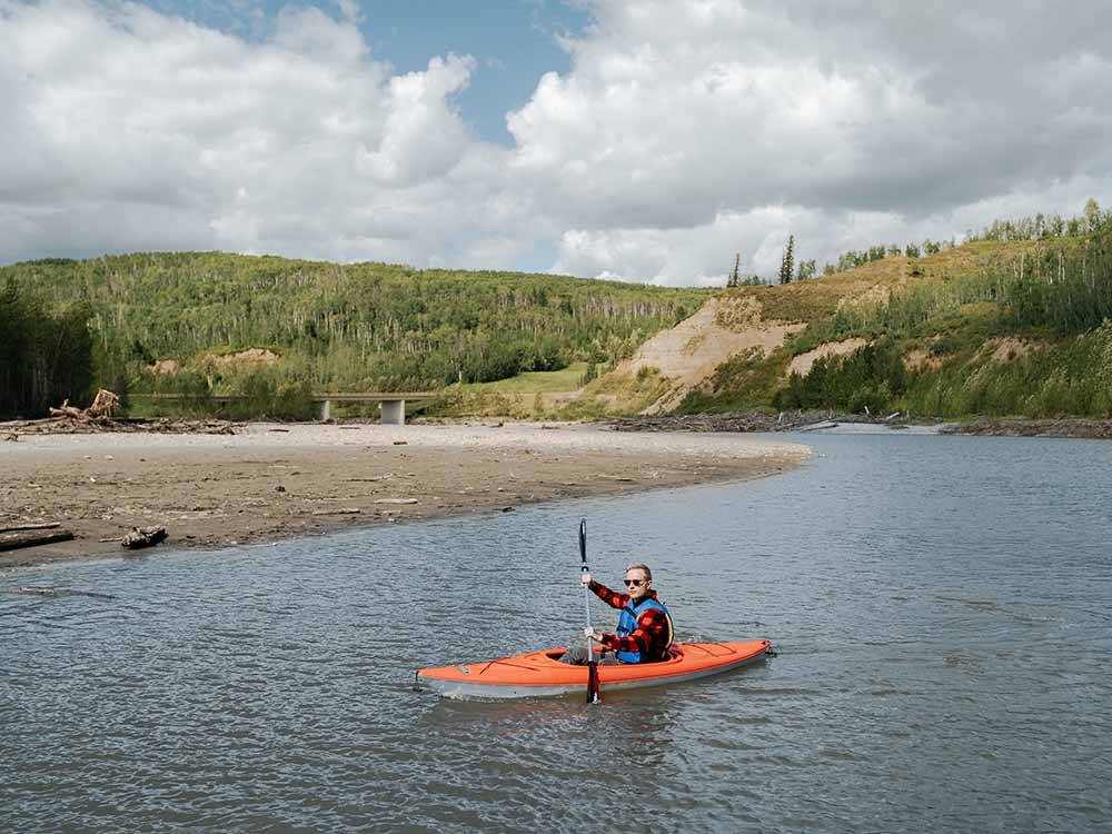 A man kayaking in the river at GRANDE PRAIRIE REGIONAL TOURISM ASSOCIATION