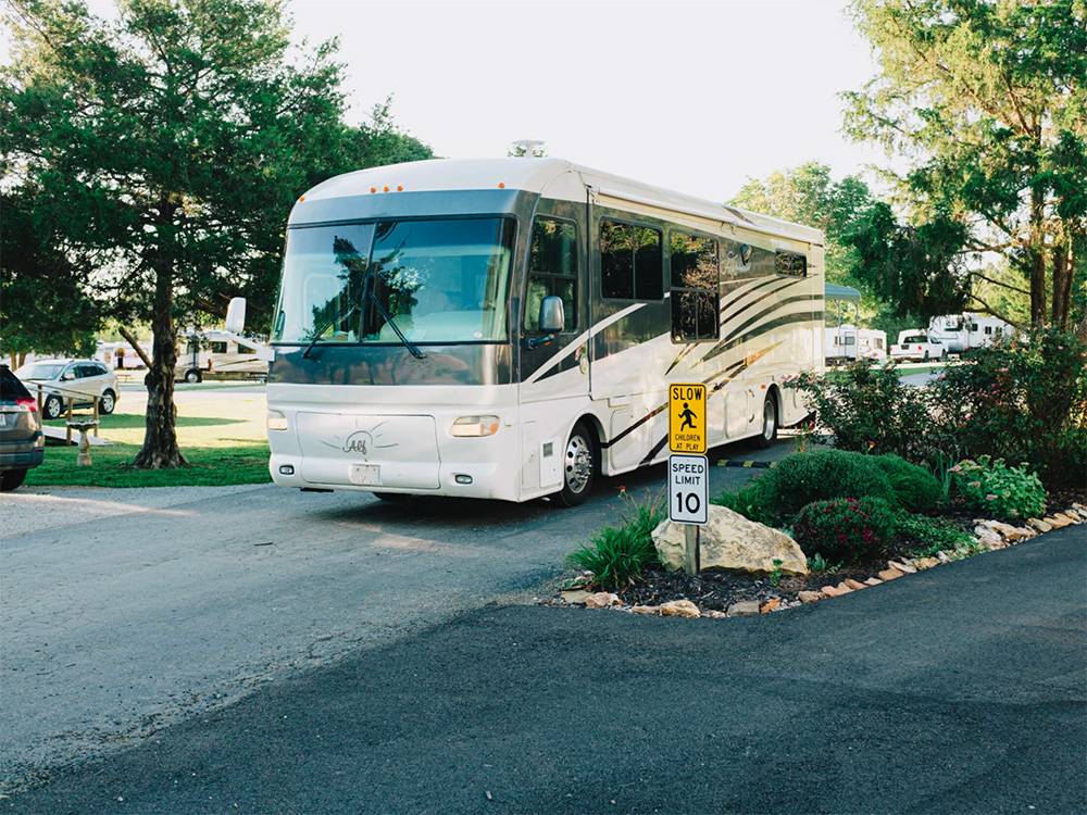 An RV driving through the park