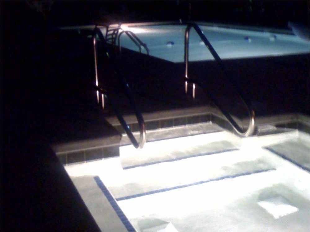 The hot tub and pool at night at THE RV RESORT AT CAROLINA CROSSROADS