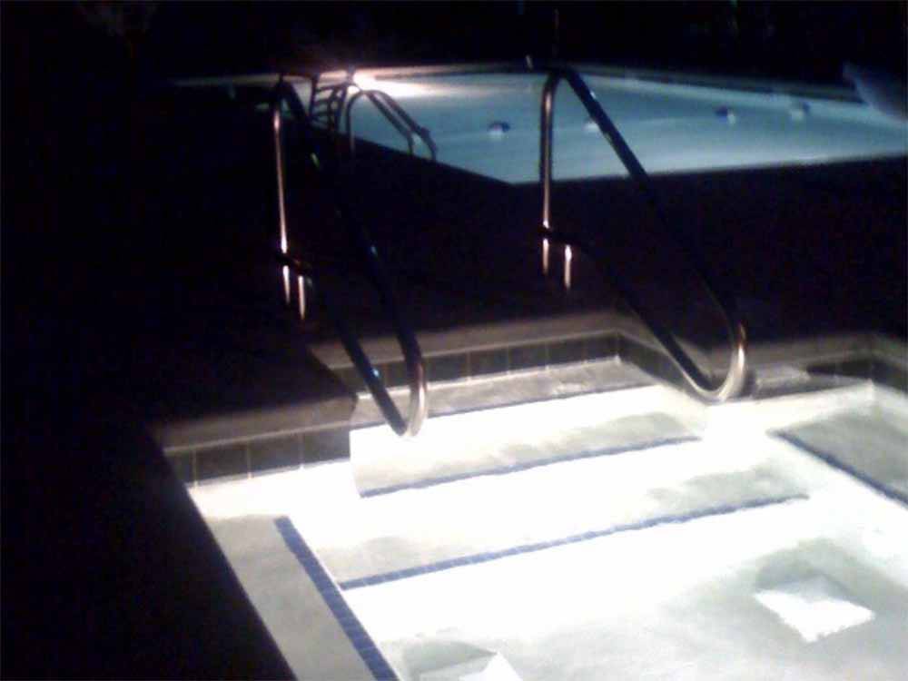 The hot tub and pool at night at The RV Resort at Carolina Crossroads